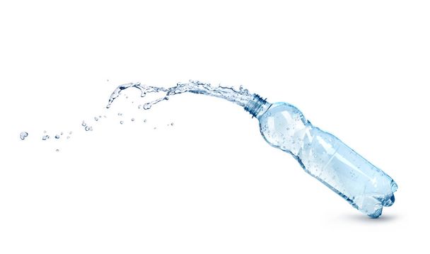 blue water splash out of plastic bottle isolated - Фото, зображення
