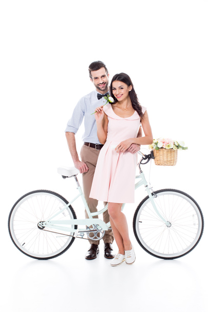 Молодая пара с велосипедом  - Фото, изображение