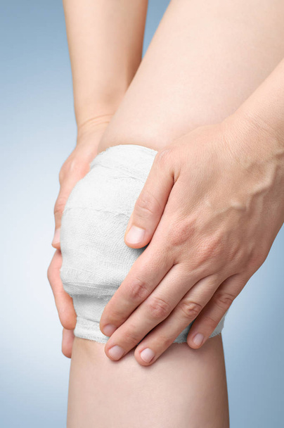 Injured knee with bandage - Photo, Image