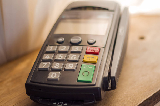 Close-up of cards servicing with POS-terminal. Payment machine. Payment card in a bank terminal. The concept of of electronic payment. - Φωτογραφία, εικόνα