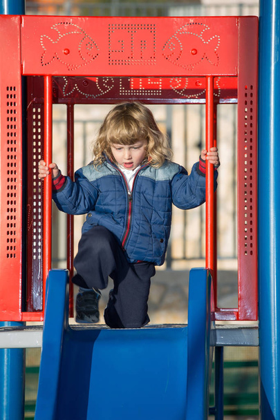 Adorable little boy playing on playground - Photo, image