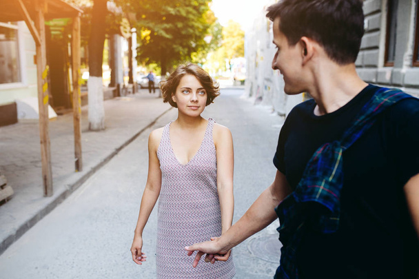 couple walking on the street holding hands - Zdjęcie, obraz