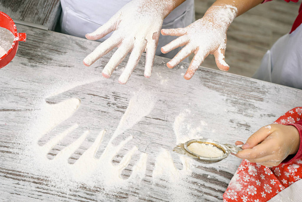 Happy family making dough in white kitchen - 写真・画像