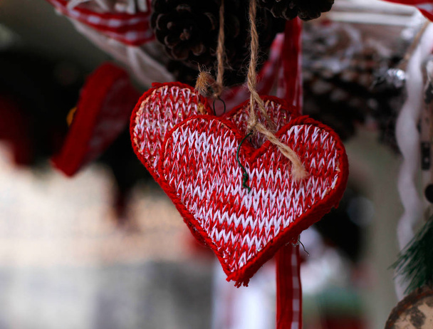 Christmas New Year's toys in the form of knitted heart - Valokuva, kuva