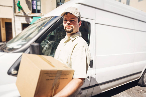 Messenger Delivering Parcel, Standing Next To His Van - Фото, зображення