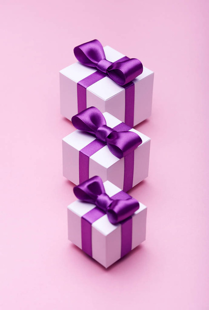 Gifts with satin bows on pink - Photo, Image