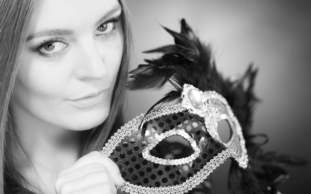 Sensual lady holding carnival mask. - Фото, зображення