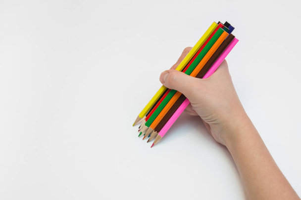 Women's right hand draws a dozen pencils - Photo, Image