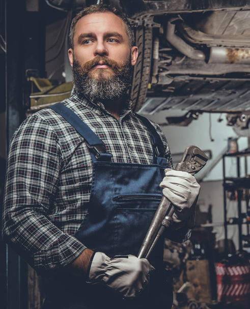 Bearded mechanic in a garage - Photo, Image