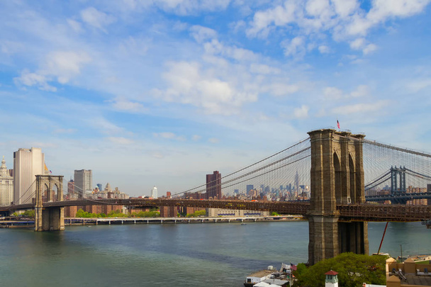 Brooklyn Bridge over East River viewed from New York City to Lower Manhattan - Photo, Image