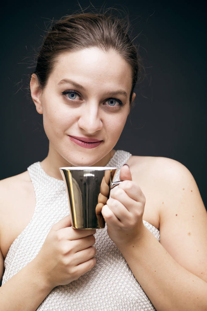Young girl with a coffee mug - Фото, изображение