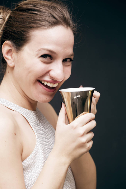Young girl with a coffee mug - Zdjęcie, obraz