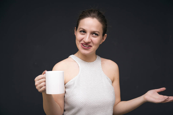 Young girl with a coffee mug - 写真・画像