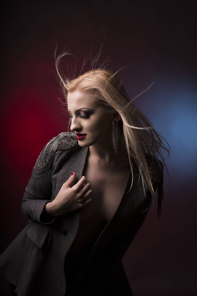 Fashionable young blonde model with hair in motion - Fotografie, Obrázek