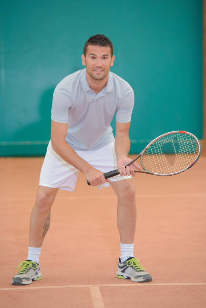Portrait of man playing tennis - Photo, Image