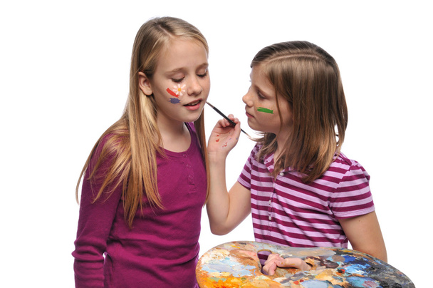 Young Girsl doing face paint - Photo, Image