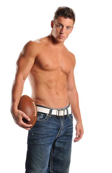 Muscular man holding a football - Fotoğraf, Görsel