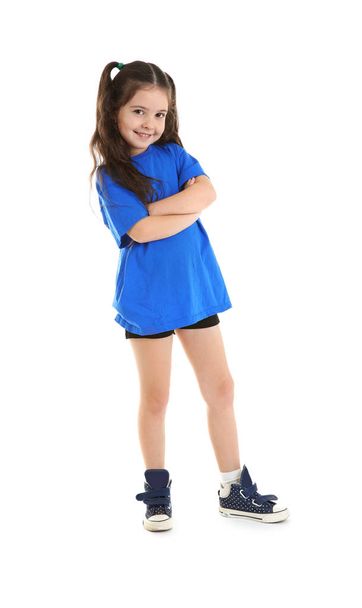 Cute little sportive girl posing on white background - Foto, imagen