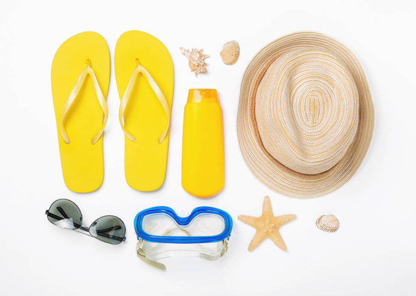 Variety beach accessories on white background. Vacation and trav - 写真・画像