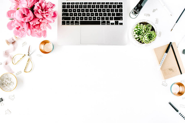 Workplace with laptop, succulent, peonies, golden scissors - Фото, изображение
