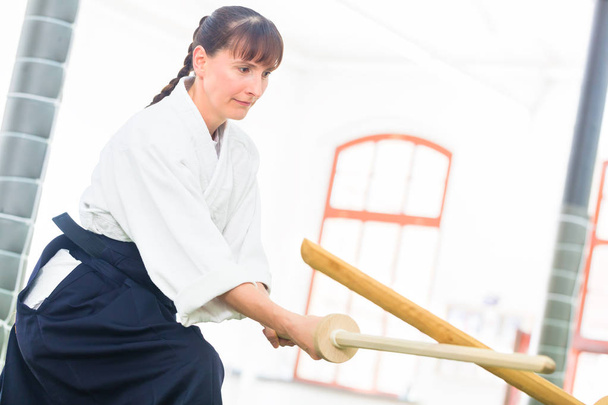 Woman having Aikido sword fight - Photo, Image