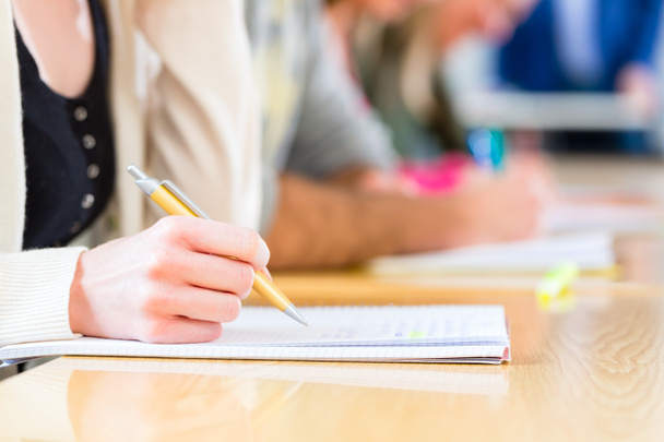 College students writing test or exam - Фото, изображение