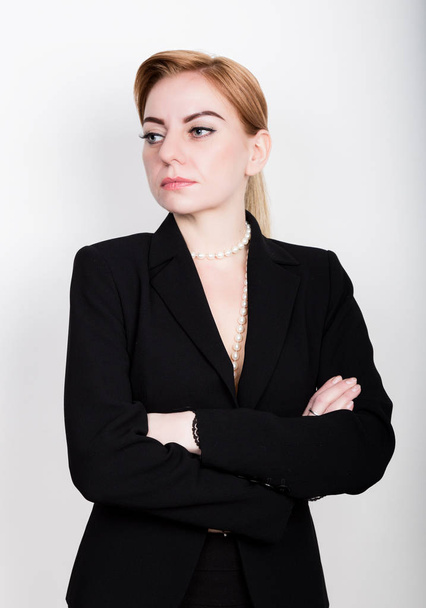 Attractive and energetic business woma in a suit on naked body - Foto, afbeelding