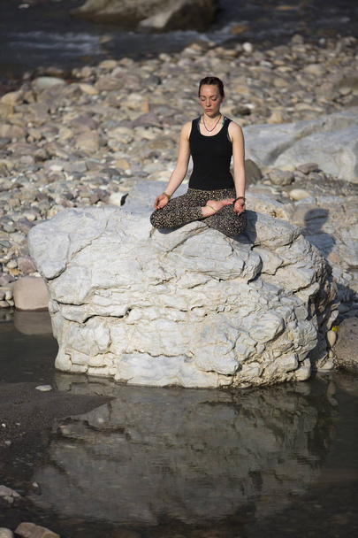 Amazing beautiful young woman does yoga. - Photo, Image