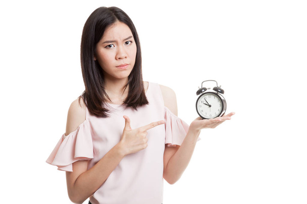 Angry young Asian woman point to a clock. - Foto, Bild