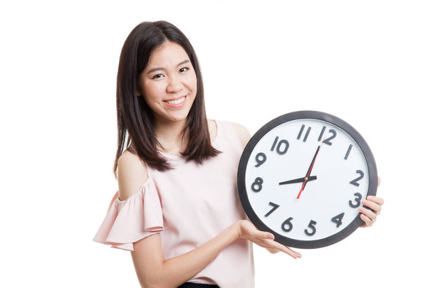 Young Asian business woman with a clock. - Фото, зображення