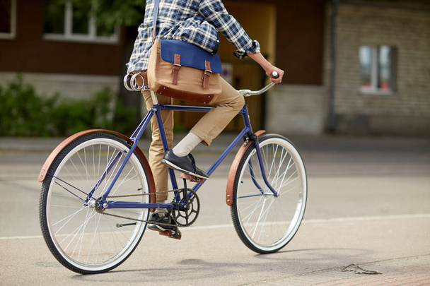 young hipster man with bag riding fixed gear bike - Φωτογραφία, εικόνα