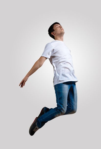 Young man dancing and jumping - Foto, imagen