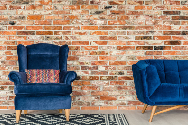 Blue upholstered armchair - 写真・画像