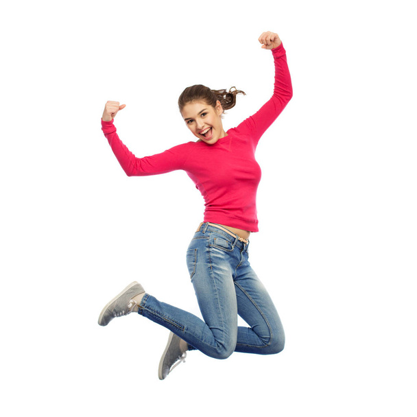 smiling young woman jumping in air - Zdjęcie, obraz