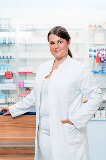 Pharmacist in chemist shop looking at camera - Photo, Image