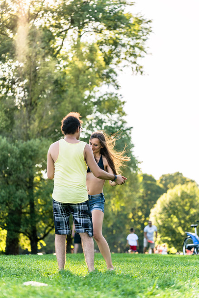 Couple dancing bachata in park  - Photo, Image