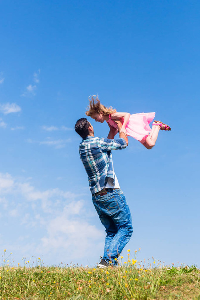Daddy spinning around his daughter - Φωτογραφία, εικόνα