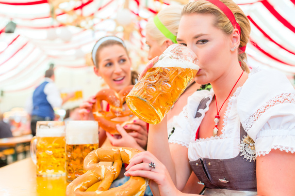 Friends drinking Bavarian beer at Oktoberfest - Photo, Image