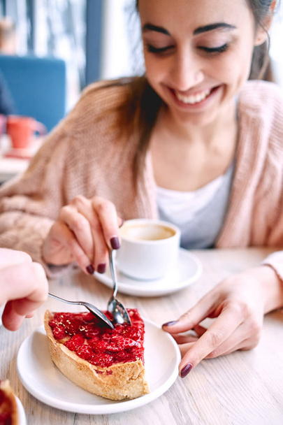 couple eating a dessert spoon in  cafe on  date - Foto, Imagen