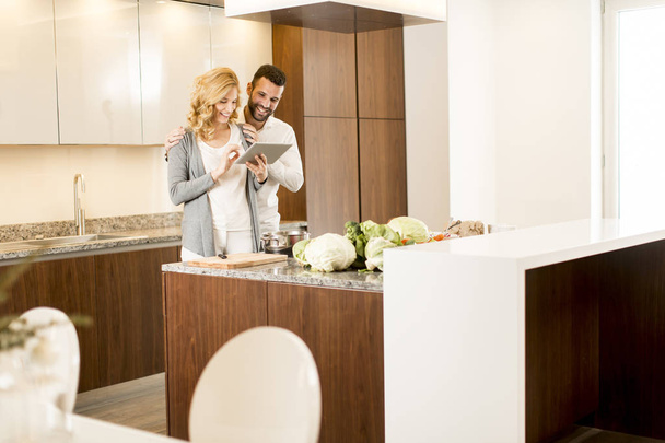 Loving couple in the modern kitchen - Photo, Image