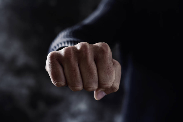 young man with his fist clenched - Photo, Image