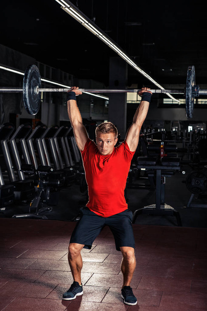 Young man at a crossfit gym - Фото, изображение