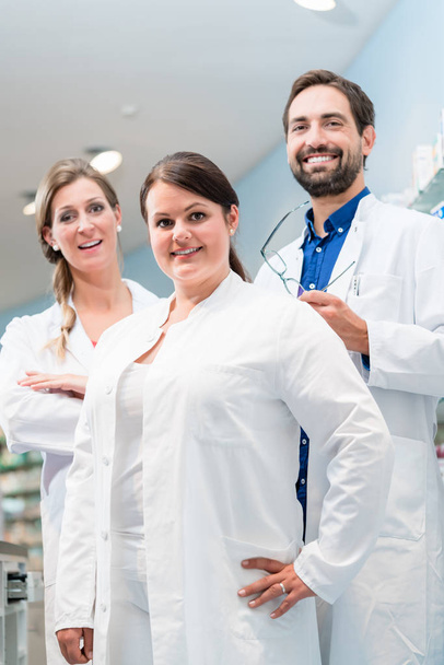 Team of apothecaries in pharmacy - Foto, imagen
