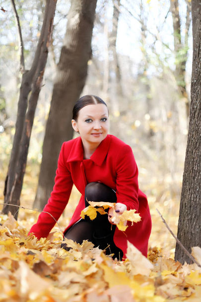 Pretty girl in red coat autumn - Zdjęcie, obraz