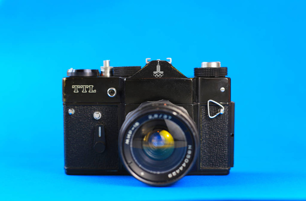 Retro camera. FED, Amateur, Zenith. Blue background - Photo, Image