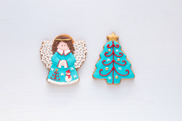 Christmas homemade gingerbread angel and christmas tree cookies  - Photo, Image