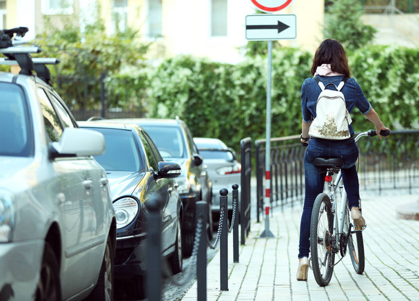 woman riding bike outdoors - 写真・画像