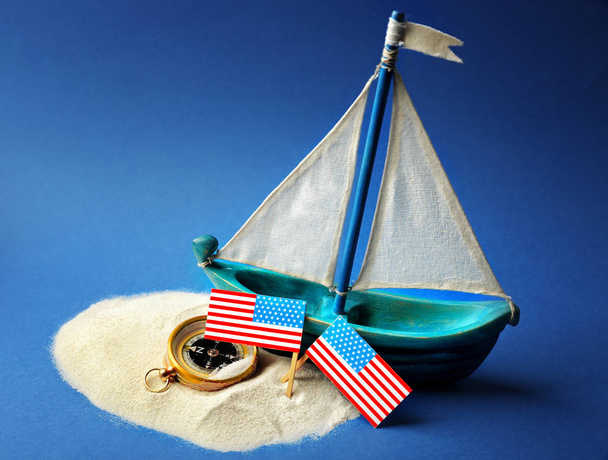 Wooden boat, USA flags and compass  - Φωτογραφία, εικόνα