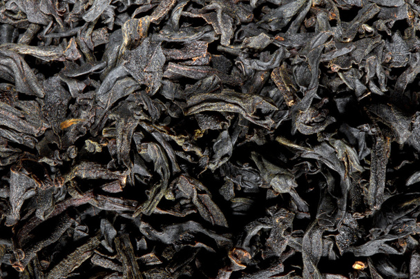 Scattered black tea texture - Фото, изображение