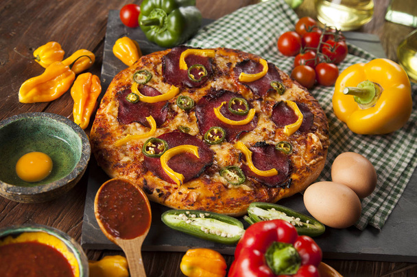 Pizza with yellow peppers - Fotoğraf, Görsel